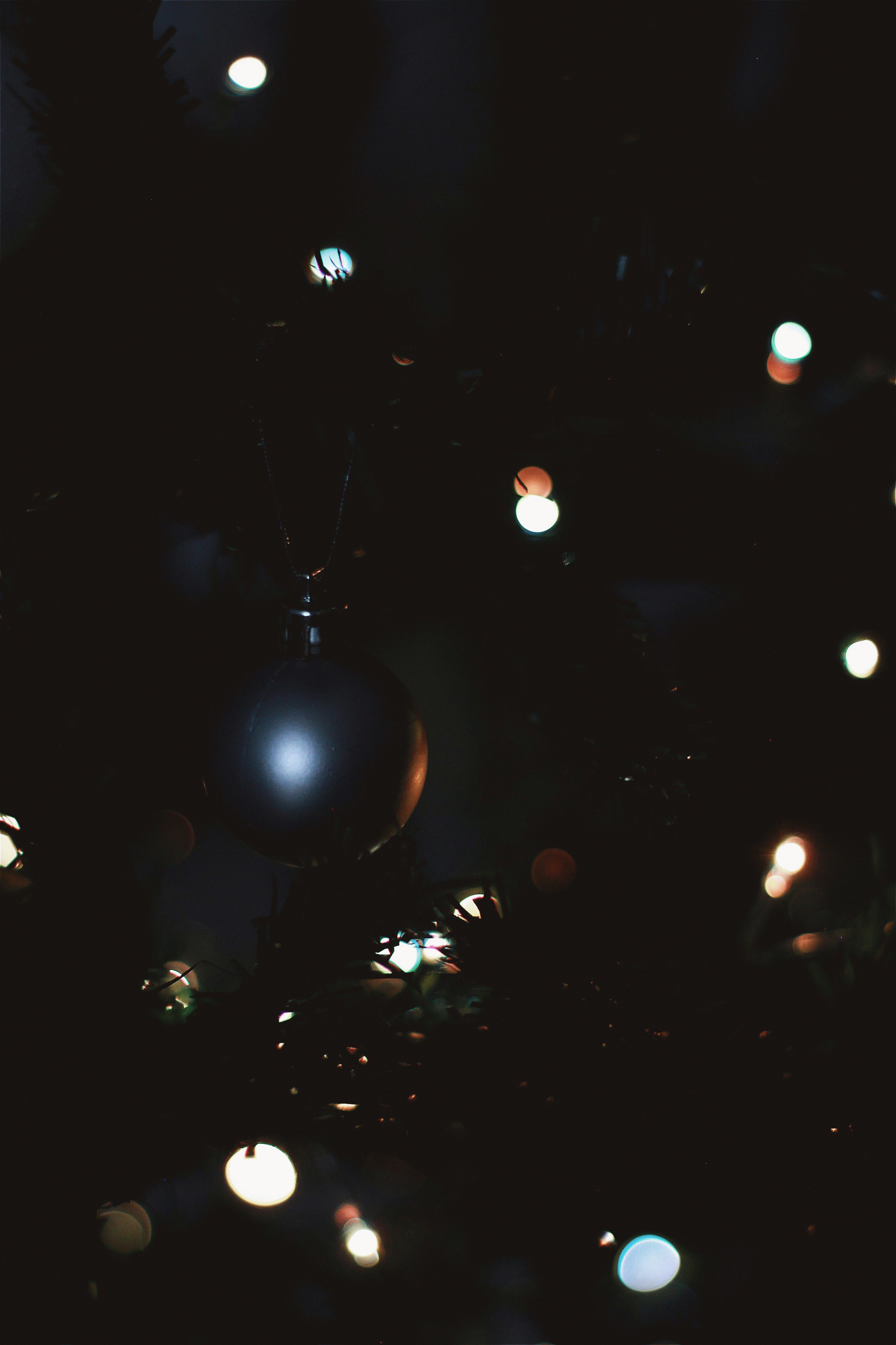 silver bauble with light on the ground